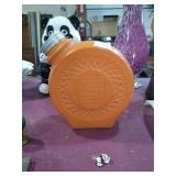 Orange glass container.