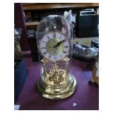 Glass incased Quartz clock.