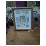 Small picture, 2 Bibles, and 2 Hymn books.