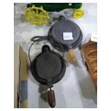 Miniature cast iron waffle irons. 
One marked
