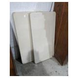 Two small folding tables