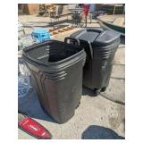 Two garbage cans
One has no lid