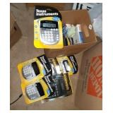 Box full of calculators and more office material