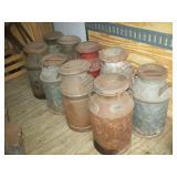 several dairy cans