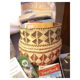 Basket with maps, tourbooks & atlas.