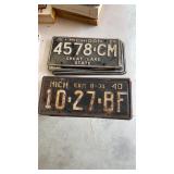 Lot with old license plates and manuals