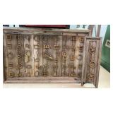 Handmade antique fastener collection display.