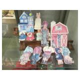 PAIR OF WOODEN DOLL CUTOUTS WITH EXTRA OUTFITS