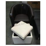 Brown upholstered barrel chair with cream storage