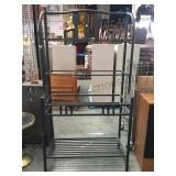 Black metal bakers rack with utensil decorations