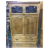Wooden armoire with lower storage and upper glass