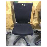 Small black padded rolling office chair no arms