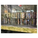 Shelf lot of DVDs including O brother where art