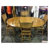 Oak dining table with two leaves and 4  pressed