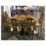 Wooden dining table with two leaves and six