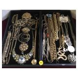 2 trays of metal fashion jewelry.