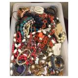 Tub full of costume jewelry