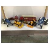 Toy truck lot including bulldozers, fire truck,