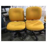 Pair of yellow gold  rolling office chairs local
