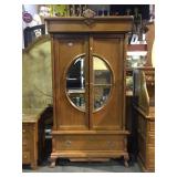 Antique-style mirror front armoire with lower