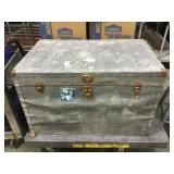 Large vintage trunk with layered metal outside