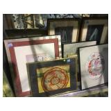 Shelf lot of framed prints and Asian fabrics