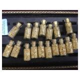 17 small bottles of gold foil