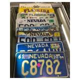 7 vintage license plates & 2 decorative plates
