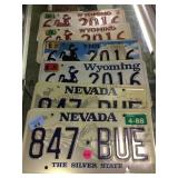 6 vintage license plates.