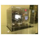 Mirrored back display case.         
Local