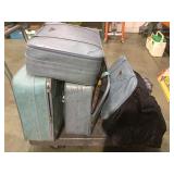 Lot of matching Monarch suitcases with contents