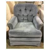 Vintage blue upholstered rocking armchair local