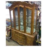 Large wooden china hutch with lights and glass