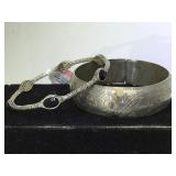 A pair of sterling bangle bracelets, 1- black