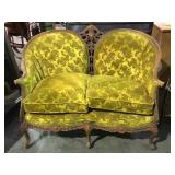 Antique Victorian ornately carved love seat.