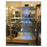 Display cabinet with a lock and key contents not