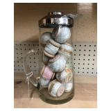 Vintage glass pitcher with cotton spools 15 in