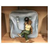 Vintage bowling bag and a metal wall hanging