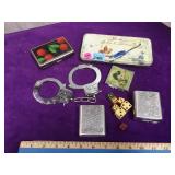 Small tins, dice, compact, china handcuffs, local