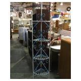 Metal 4 tiered corner shelf.         
Local