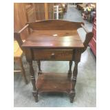 Small wood cabinet w/ drawer & side bars.