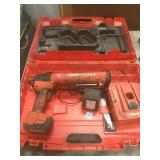 Hilti power caulking gun in case.    
Local