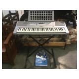 Yamaha keyboard w/ stand & book.     
Local