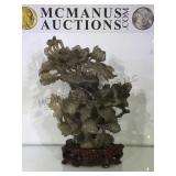 Ornately carved jade vase on stand, damage to 1