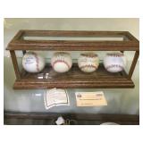 Oak Cased set of autographed baseballs, signed