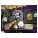 Brass powder flask, 3 compasses, belt buckles