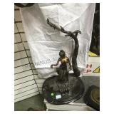 Bronze lady on a Swing