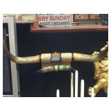 2 pair of horns mounted on wooden hanger 28 and