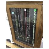 Hanging display case with assorted vintage