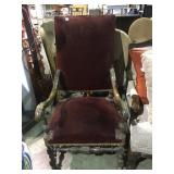 Ornate wooden arm chair w/ velvet upholstery,